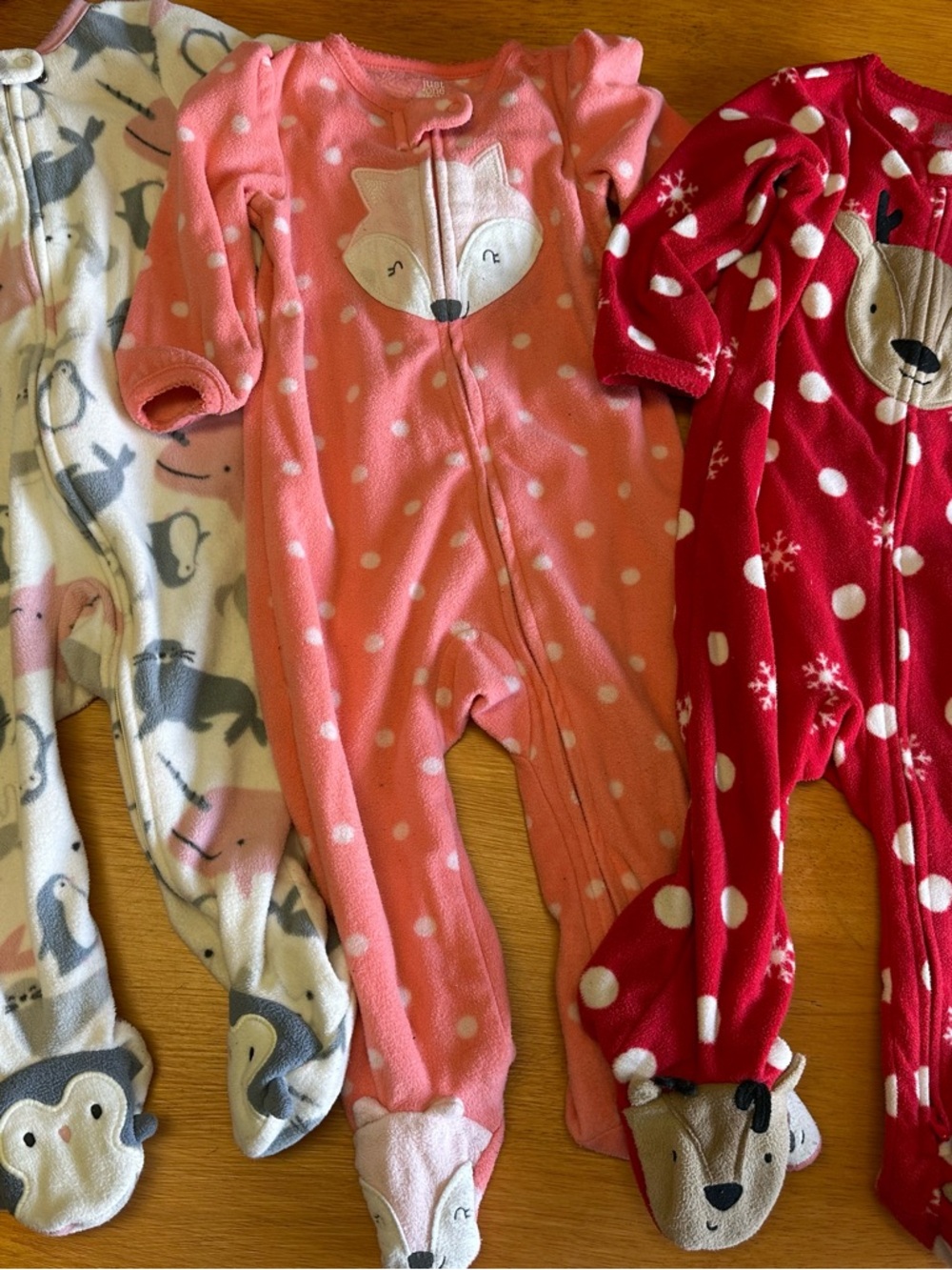 Set of 3 Fleece Footie Pajamas. Cream Arctic animals, coral fox, red reindeer.